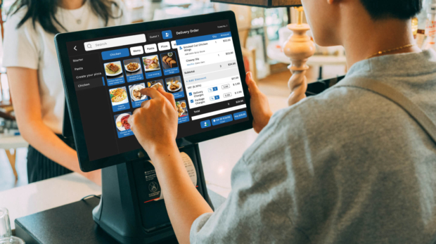 restaurant waiter using vouch pos for order taking